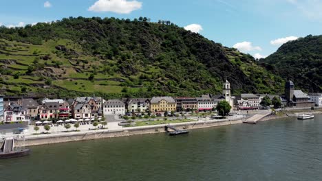 Aerial-flying-drone-shot,-stable,-of-the-Rhine-River-Valley-and-Old-Architecture---including-medieval-castles,-old-buildings,-and-natural-forested-alpine-hills