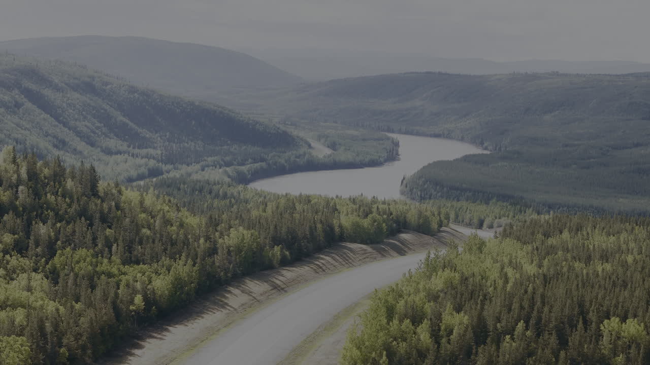 A breathtaking aerial of the Alaska Highway’s remote stretch.