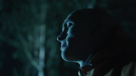 person in forest at night