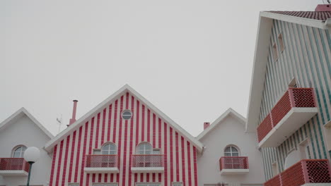 striped houses with red and blue accents in the center of aveiro, portugal