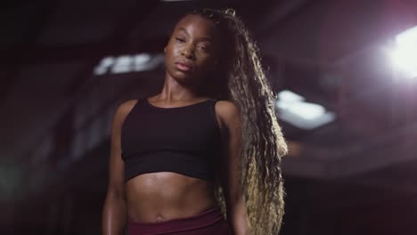 Studio-Portrait-Of-Woman-Wearing-Fitness-Clothing-Standing-In-Gym-3