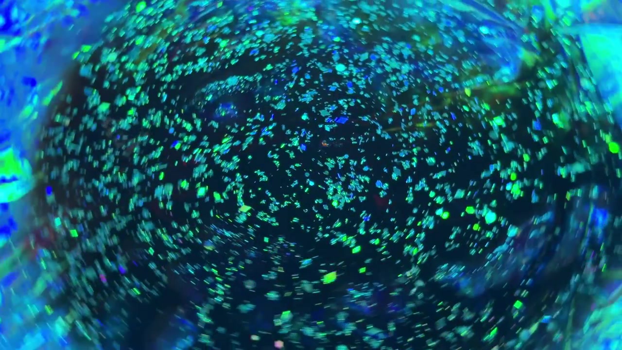 Abstract swirls of blue and green light