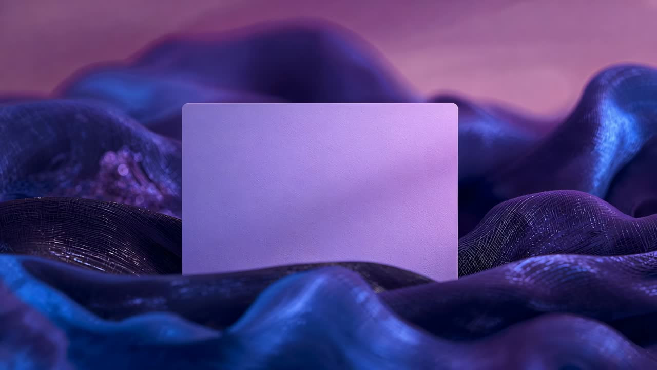 Shifting satin fabric revealing centered lavender card near lower-middle, with crystalline cluster