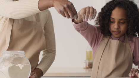 mother and daughter baking together