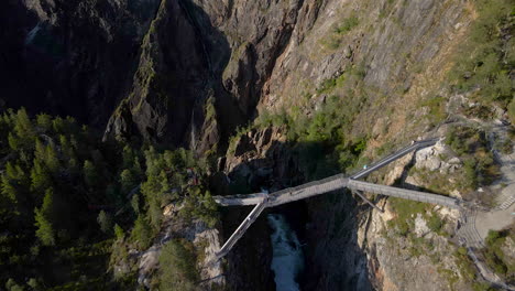 Aerial-flight-over-new-viewing-bridge-at-precipitous-Voring-falls,-Norway