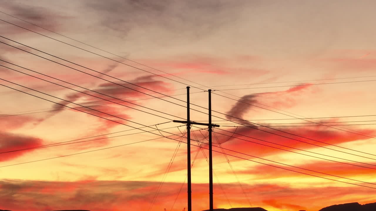 Silhouette of High Tension Electric Transmission Lines During Golden Sunset