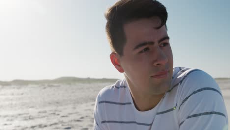 Man-crouching-on-the-beach