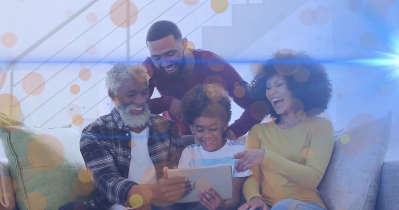 Animation of dots moving over happy african american multi generation family using tablet