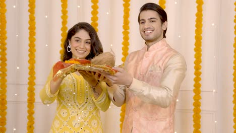 indian couple praying to god