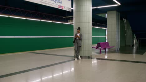 woman waiting at subway station