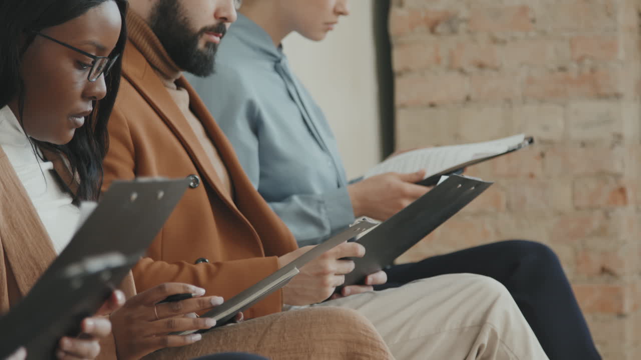 Unrecognizable Manager Handing Out Application Forms