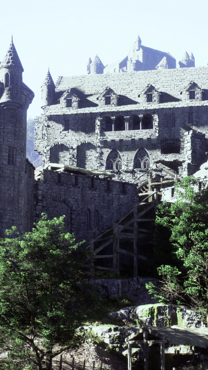 Majestic medieval castle perched on a hillside surrounded by trees