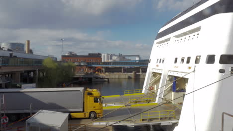 truck getting into cargo section of a ship