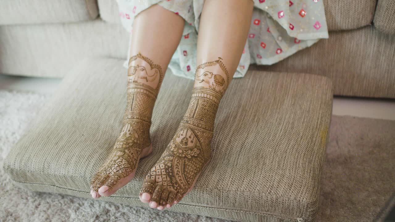 Bride's Legs With Mehndi Body Art For An