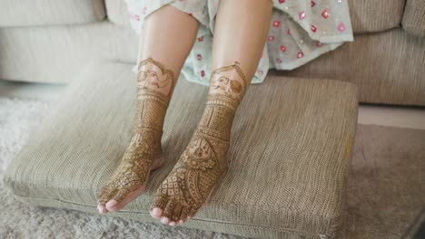 bride's legs with mehndi body art for an