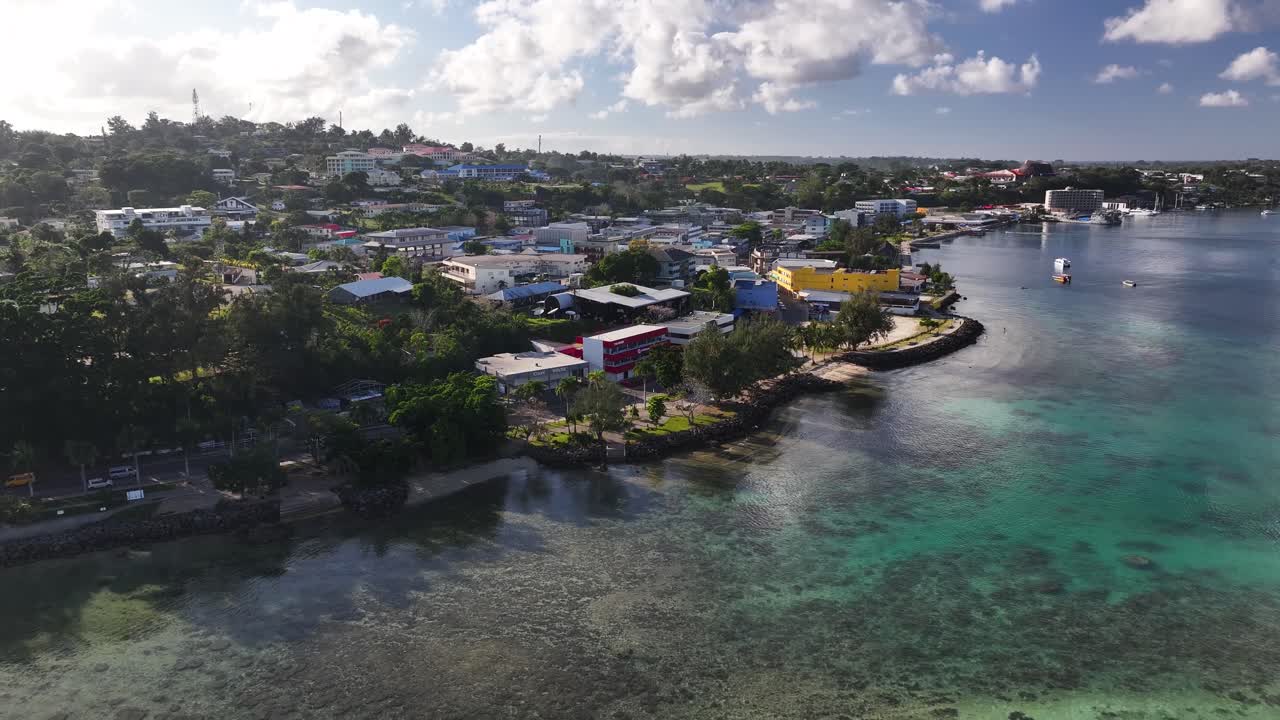 Aerial View of a Coastal Town on a Tropical Island