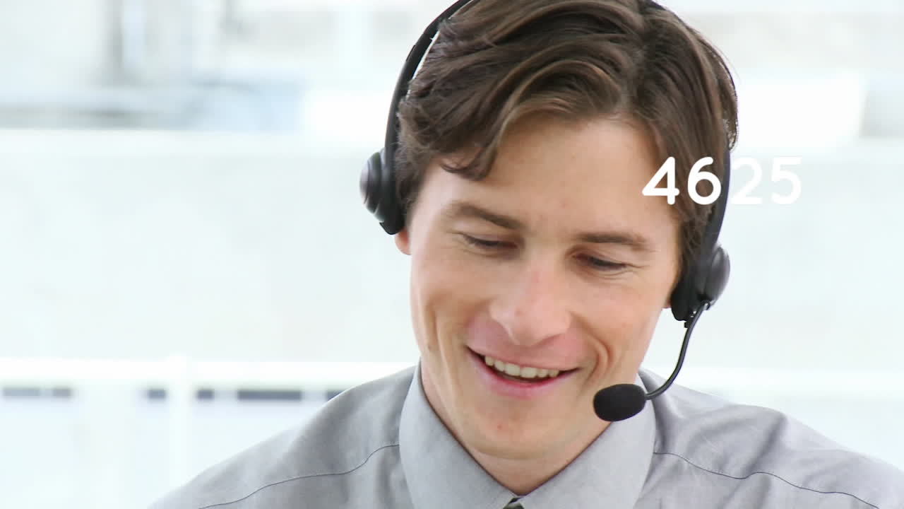 Animation of numbers changing over businessman using phone headset