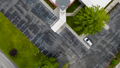 High-angle-tilt-to-top-down-over-a-church