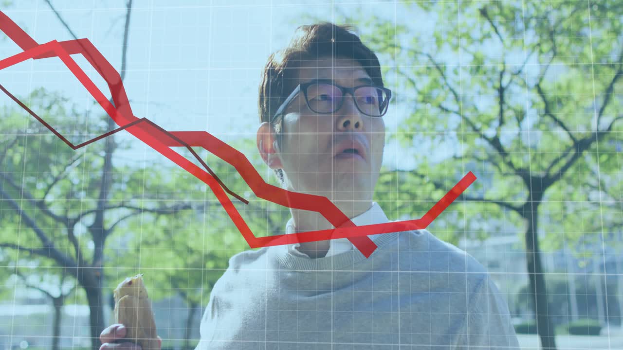 Mature man sipping coffee and monitoring descending then rising finance graph overlay in plaza