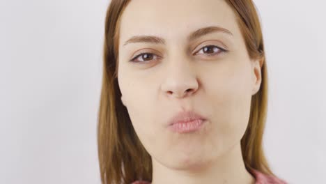 woman eating dried peach close-up. dry fruits.