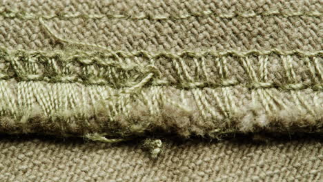 close-up of a frayed denim seam
