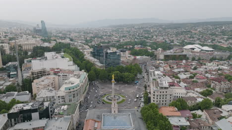 cityscape of tbilisi, including saint george statue and the freedom square