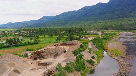 Countryside-Quarry-Site-With-Working-Truck-Loaders-At-Daytime-In-Southern-Leyte,-Philippines