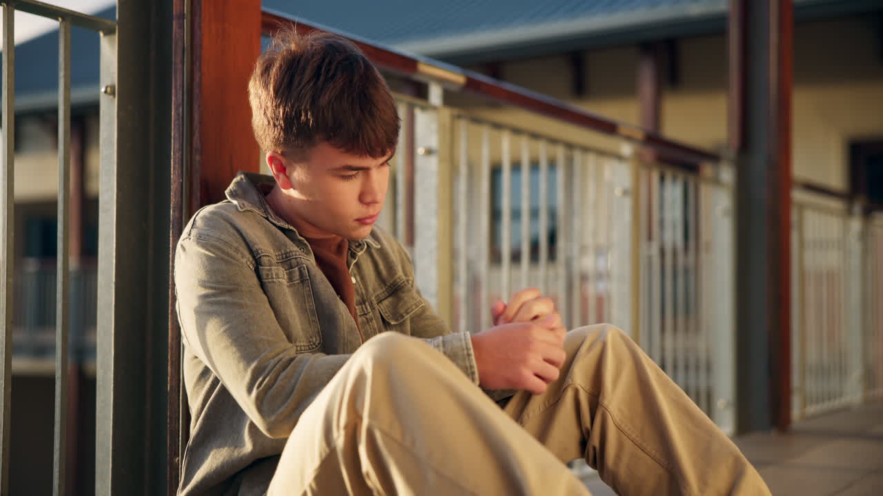 Sad Teenager Sitting Alone