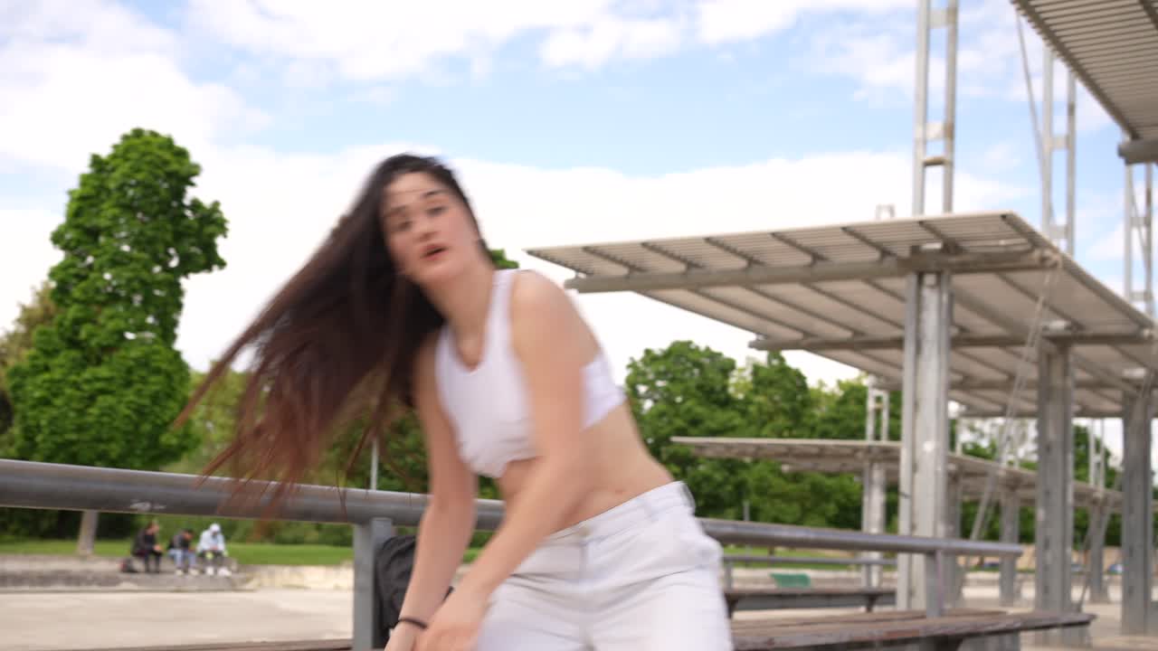 Woman Dancing Outdoors in an Urban Park