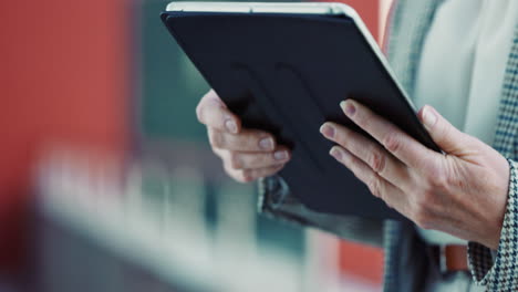 woman using a tablet outdoors