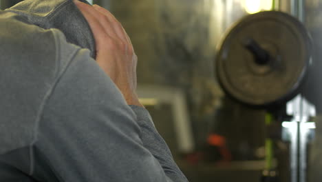 depressed man having nervous breakdown at the gym, dolly shot