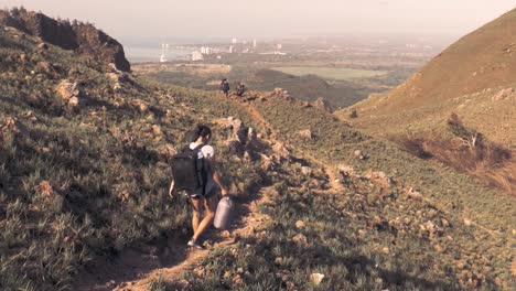 drone footage of people hiking down the mountain