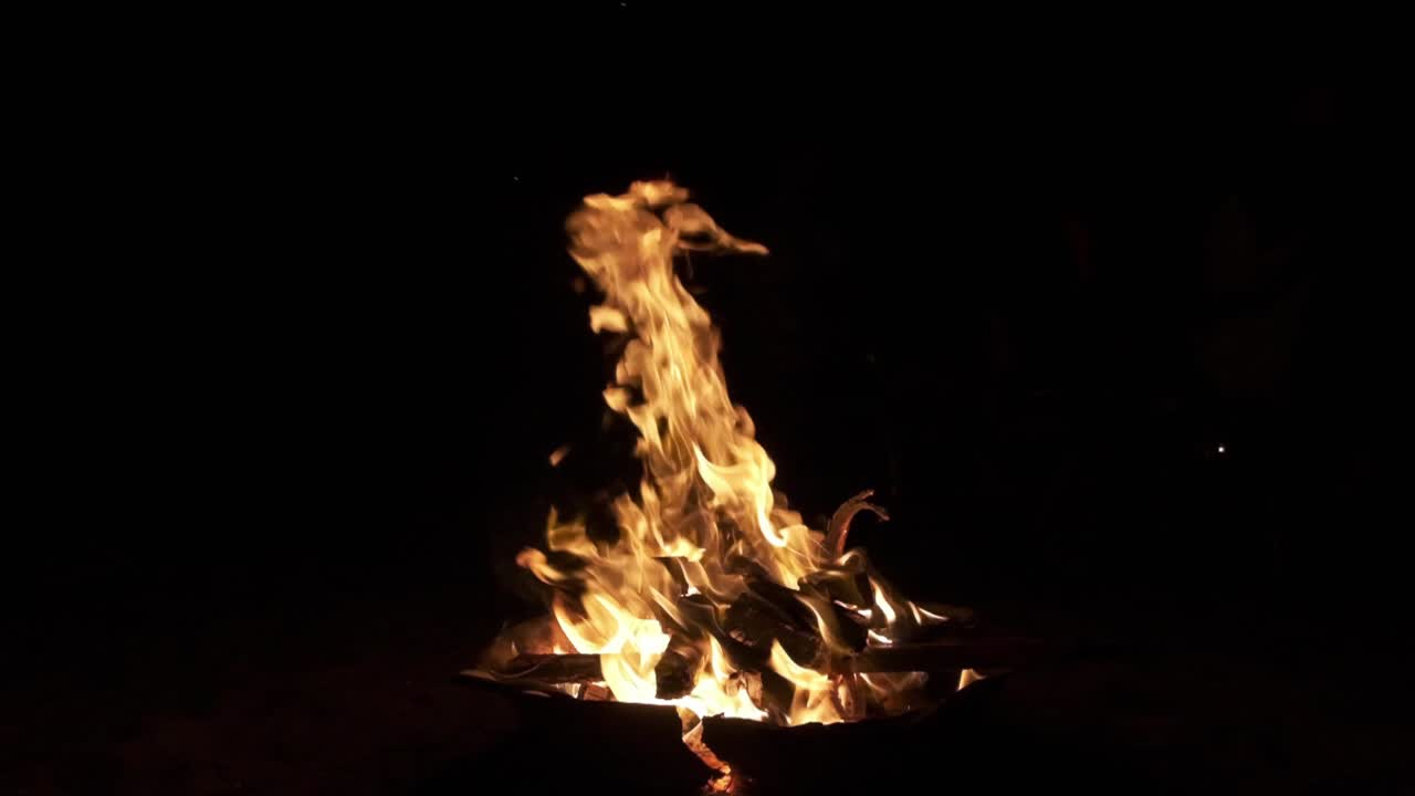 small fire shot at night in slow motion
