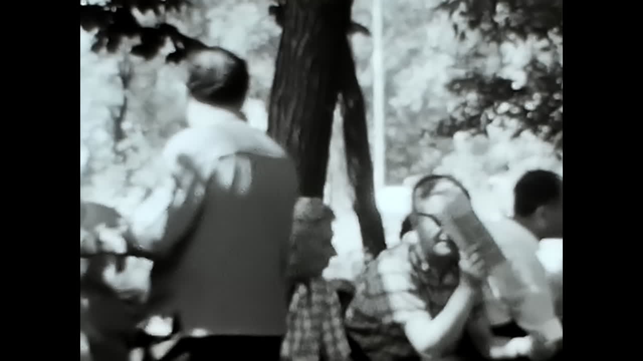 Group of People in Black and White, Historical Video From the Soviet Union Archive. CIRCA USSR 1970: A remarkable black and white video capturing a group of people during the Soviet era in the USSR.