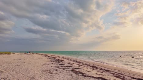Golden hour beach view at Holbox Punta Cocos, Mexico, calm waves and skies