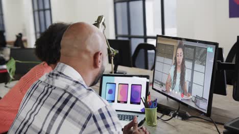 African-american-business-people-on-video-call-with-caucasian-female-colleague-on-screen