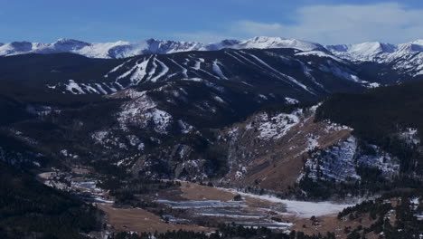 Eldora-Mountain-ski-trail-runs-Indian-Peaks-Woodward-Ikon-Pass-Colorado-cinematic-aerial-drone-Boulder-Flat-Irons-Nederland-Front-Range-winter-blue-sky-Central-city-Black-Hawk-forward-upward-motion