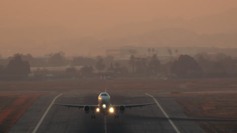 airplane takeoff with active lights