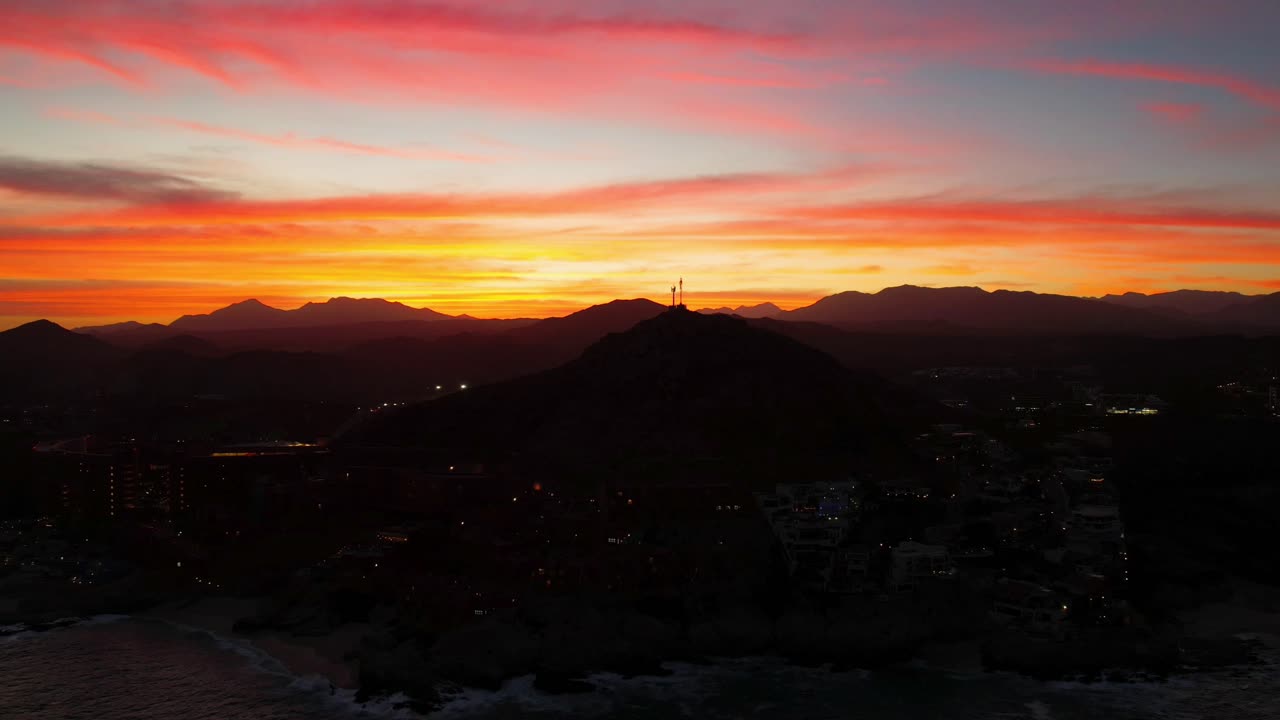 Aerial footage of waves moving near a seaside resort in Cabo, Mexico