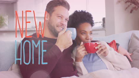 animation of new home text over diverse couple drinking coffee on sofa