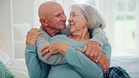 Senior-couple,-hug-and-kiss-in-bedroom