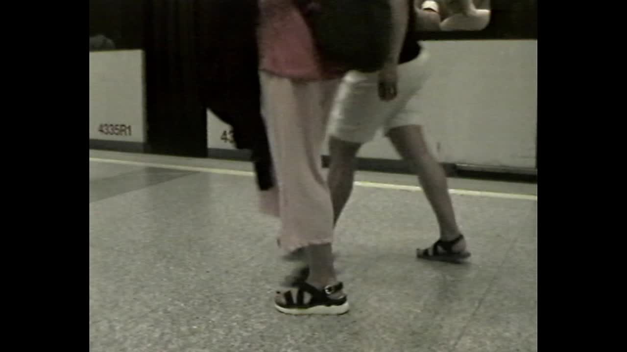 Man walking on subway platform near train