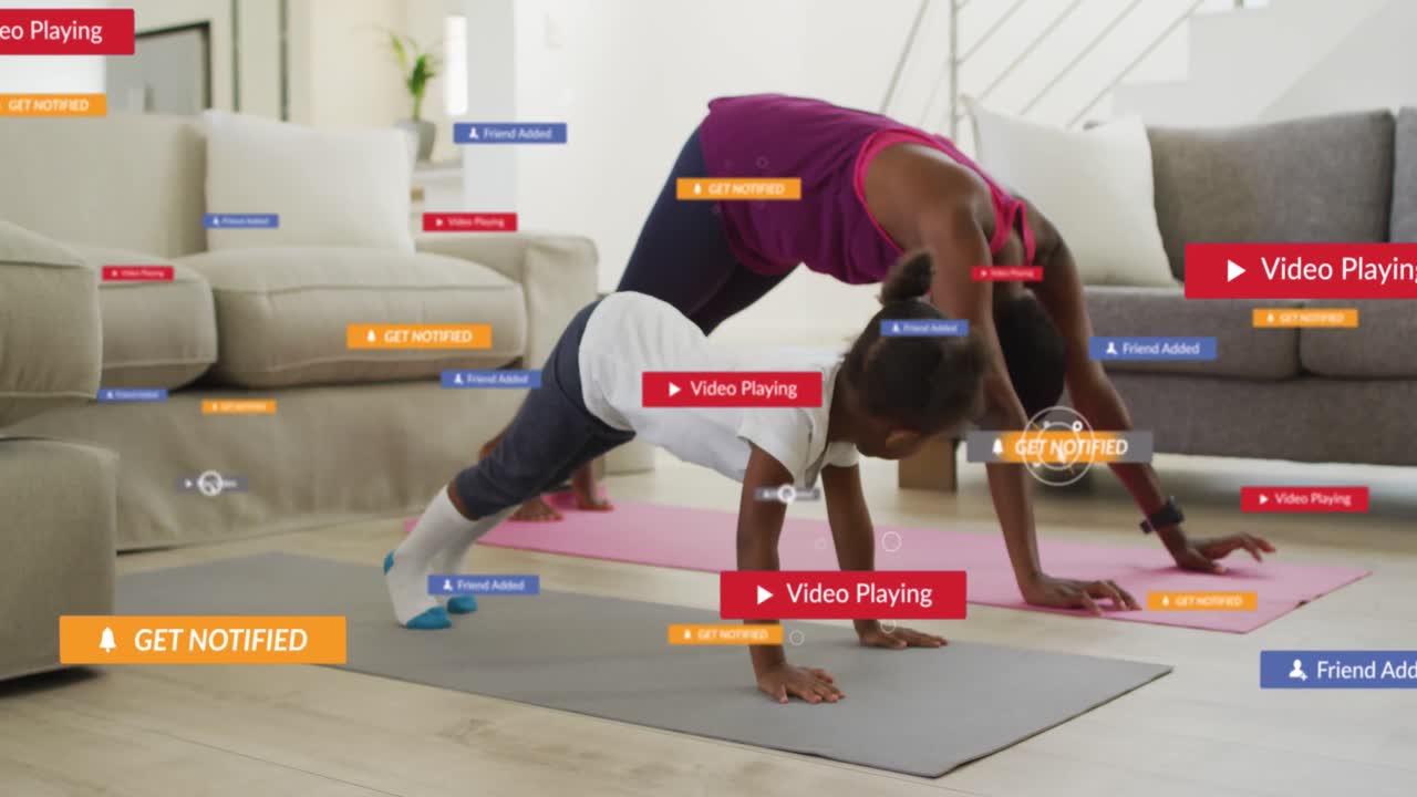 Animation of social media icons and text over mother and daughter exercising at home