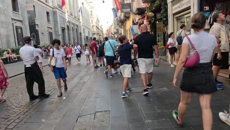 crowded street with people walking in naples