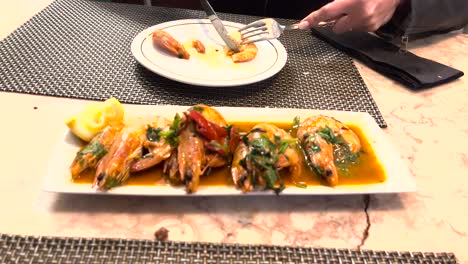 grilled shrimp à bolhão pato with garlic, a famous and traditional dish from lisbon