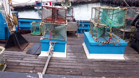 crab pots on a boat in harbor