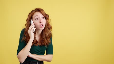 concerned red-haired woman talking on phone