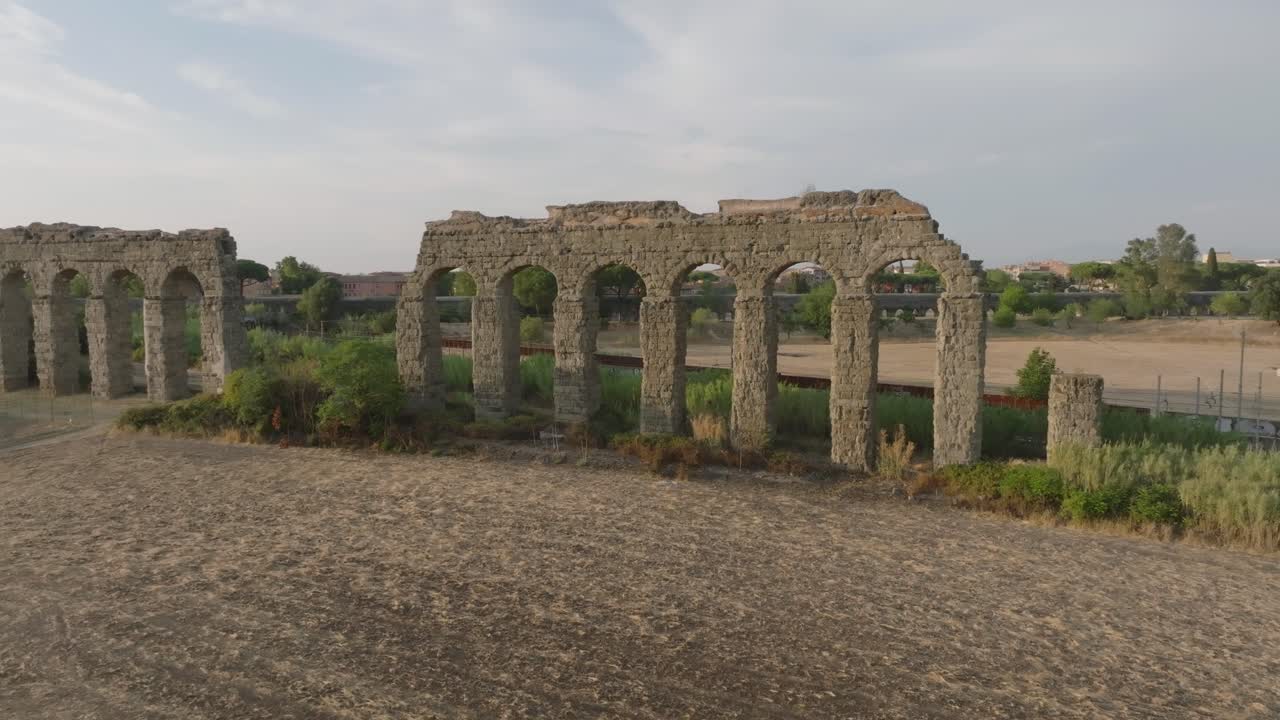 An aerial shot of an Italian aqueduct as the drone approaches the structure.