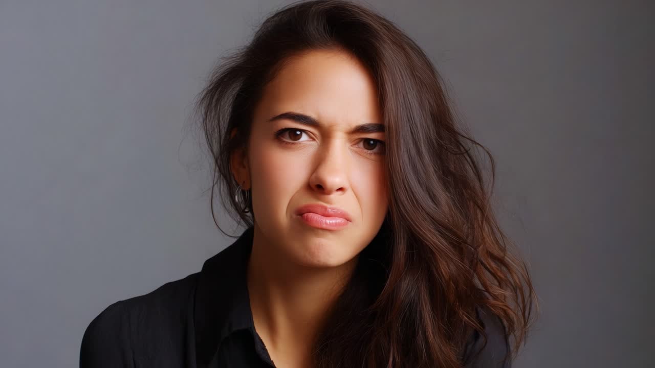 A young woman displays a range of facial expressions reflecting annoyance and disgust, showcasing the intricacies of human emotion through her unique facial contortions and reactions