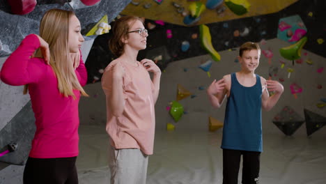 friends warming up in a climbing gym